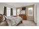 Bedroom featuring lots of light, neutral carpet and a large dresser at 3601 E 103Rd Cir # B11, Thornton, CO 80229