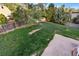 Large backyard with a wooden fence, ample green space, and concrete patio at 12780 Elm St, Thornton, CO 80241