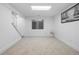 Finished basement offering ample space and natural light through a window at 12780 Elm St, Thornton, CO 80241