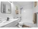 Bright bathroom featuring a black shower head and modern fixtures at 12780 Elm St, Thornton, CO 80241
