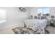 Cozy bedroom featuring a window view and patterned bedding at 12780 Elm St, Thornton, CO 80241