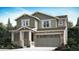 Charming two-story home featuring a stone facade, inviting front porch, and a neutral color scheme at 28614 E 7Th Ave, Watkins, CO 80137