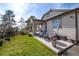 Expansive backyard with a patio, seating, and a view of the lush surroundings at 23742 E Calhoun Ave, Aurora, CO 80016