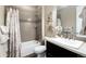 Bathroom with bathtub, shower, vanity and decorative wall art at 23742 E Calhoun Ave, Aurora, CO 80016