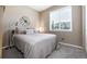 Bedroom with a large window and neutral decor at 23742 E Calhoun Ave, Aurora, CO 80016