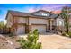 Charming home with a three car garage, stone accents, and well manicured landscaping at 23742 E Calhoun Ave, Aurora, CO 80016