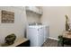 Laundry room with washer, dryer, shelving and decor at 23742 E Calhoun Ave, Aurora, CO 80016