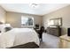 Carpeted main bedroom with a large window and dresser with decor at 23742 E Calhoun Ave, Aurora, CO 80016