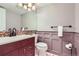 Stylish powder room featuring a modern vanity with mosaic tile backsplash at 9902 Independence St, Broomfield, CO 80021