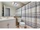 Comfortable bathroom with a shower curtain and updated sink at 9902 Independence St, Broomfield, CO 80021