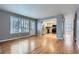Bright living room with hardwood floors flows into kitchen with stainless steel appliances at 9902 Independence St, Broomfield, CO 80021