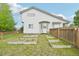 Backyard features garden and wooden privacy fence at 3745 Balderas St, Brighton, CO 80601