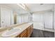 Bathroom boasts double sinks, a soaking tub, walk-in shower, and a large mirror at 3745 Balderas St, Brighton, CO 80601