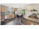 Bright dining area featuring hardwood floors, stainless steel appliances, and a view of the yard at 3745 Balderas St, Brighton, CO 80601
