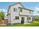 White home exterior features trim, patio, and partial fence at 3745 Balderas St, Brighton, CO 80601