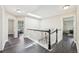 Bright hallway features an abundance of natural light from skylight and open floorplan at 3745 Balderas St, Brighton, CO 80601