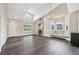Bright living room with hardwood floors, a fireplace and an elegant chandelier at 3745 Balderas St, Brighton, CO 80601