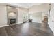 Spacious living room featuring hardwood floors, a fireplace, and bright natural light at 3745 Balderas St, Brighton, CO 80601