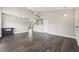 Open-concept living room with hardwood floors and staircase at 3745 Balderas St, Brighton, CO 80601