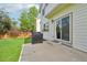 A patio area with a grill, ideal for outdoor cooking and gatherings at 3745 Balderas St, Brighton, CO 80601