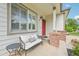 Inviting front porch with a cozy cushioned seat, perfect for enjoying the outdoors at 3745 Balderas St, Brighton, CO 80601