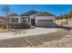 Charming two-story home featuring a well-manicured yard and a spacious two-car garage with a curved driveway at 3309 Thornwood Ct, Castle Rock, CO 80108