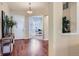 Inviting foyer with gleaming hardwood floors and view to the office space at 3309 Thornwood Ct, Castle Rock, CO 80108