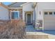 Close-up of the front entrance, showcasing the detailed stonework and craftsman-style door at 3309 Thornwood Ct, Castle Rock, CO 80108