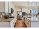 Modern kitchen with stainless steel appliances, granite countertops, and beautiful cabinetry at 3309 Thornwood Ct, Castle Rock, CO 80108