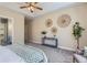 Relaxing main bedroom with a trey ceiling, ceiling fan, and cozy furniture at 3309 Thornwood Ct, Castle Rock, CO 80108