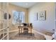 Cozy home office with natural light, neutral tones, and a vintage touch with artwork and decor at 3309 Thornwood Ct, Castle Rock, CO 80108