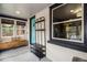 Bright entryway with large windows, bench seating and modern coat rack at 4419 Julian St, Denver, CO 80211