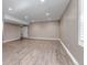Open basement space with recessed lighting, wood flooring, neutral walls, and a window at 11494 Colony Loop, Parker, CO 80138