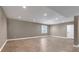 Open basement space with recessed lighting, wood flooring, neutral walls, and a window at 11494 Colony Loop, Parker, CO 80138