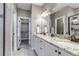 Elegant bathroom with double vanity, granite counters, and ample cabinet space at 11494 Colony Loop, Parker, CO 80138