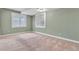 Carpeted bedroom with green walls and windows with white shutters at 11494 Colony Loop, Parker, CO 80138