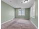 Carpeted bedroom with green walls and windows with white shutters at 11494 Colony Loop, Parker, CO 80138