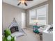 Charming bedroom featuring a decorative tent, modern chair, and window with plantation shutters at 11494 Colony Loop, Parker, CO 80138
