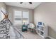 Charming bedroom featuring a decorative tent, modern chair, and window with plantation shutters at 11494 Colony Loop, Parker, CO 80138