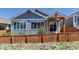 Charming home with a well-maintained wooden fence and neutral gray siding at 11494 Colony Loop, Parker, CO 80138