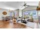 Bright living room with hardwood floors, vaulted ceilings, and large windows offering great natural light at 11494 Colony Loop, Parker, CO 80138