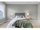 Calm main bedroom featuring a comfortable bed and matching side tables at 11494 Colony Loop, Parker, CO 80138
