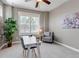 Bright home office with a ceiling fan, desk, chair, and large window with plantation shutters at 11494 Colony Loop, Parker, CO 80138