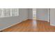 Bright bedroom with wood floors and a view of the trees at 28 Deer Rd, Evergreen, CO 80439