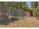 Chain link fence next to a wooden shed at 28 Deer Rd, Evergreen, CO 80439