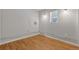 Simple laundry room with light gray walls and wood flooring at 28 Deer Rd, Evergreen, CO 80439