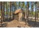 Small log cabin nestled in a wooded area at 28 Deer Rd, Evergreen, CO 80439