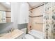 Cozy bathroom featuring tiled walls, a shower-tub combo, and vanity at 3059 Curtis St, Denver, CO 80205