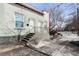 Charming bungalow-style home featuring a painted brick facade, a cozy entrance, and a well-maintained front yard at 3059 Curtis St, Denver, CO 80205