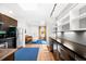 Bright, open layout connecting a modern kitchen to a living area with a skylight above a workspace at 3059 Curtis St, Denver, CO 80205